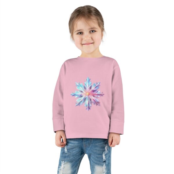 Tee - A vibrant, geometric snowflake with radiant shades of blue, pink, and white, set against a soft gradient background.