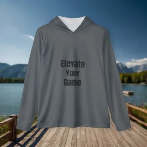 Flat lay of gray hoodie with the slogan “Elevate Your Game” placed on a boardwalk by a mountain lake.
