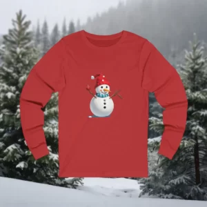 Long-sleeve shirt featuring a cheerful snowman wearing a red Santa hat and scarf, holding holiday ornaments on twig arms, set against a snowy forest background.