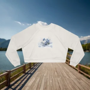 Flat lay of a white cropped sweatshirt with soft blue flowers in a watercolor style