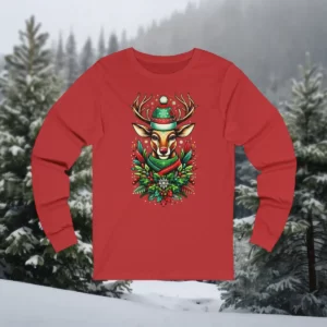 Long-sleeve shirt featuring a festive reindeer wearing a winter hat and scarf, surrounded by holiday greenery and berries, set against a snowy forest backdrop.