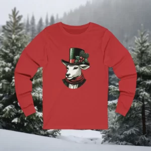 Long-sleeve shirt featuring a Victorian Christmas goat illustration with a top hat, scarf, and festive greenery, set against a snowy forest background.