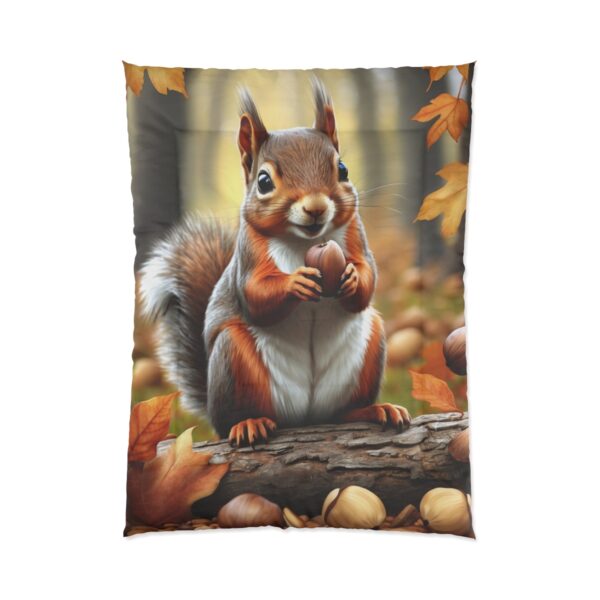 A Comforter featuring a detailed image of a squirrel holding an acorn, surrounded by autumn leaves and nuts in a forest setting.