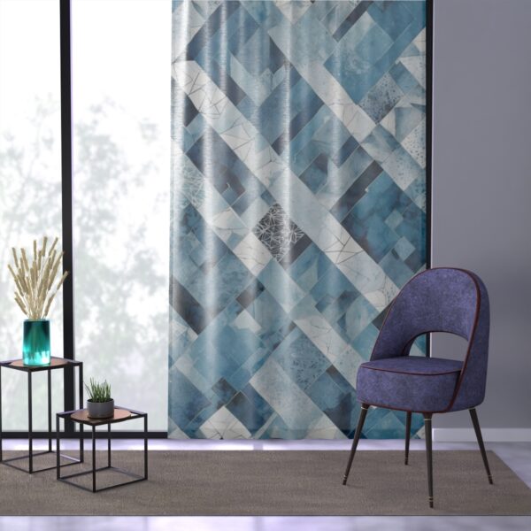 Sophisticated curtain with sharp geometric angles in arctic blue and white.