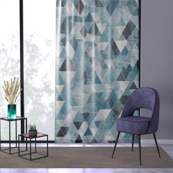 Modern window curtain with crisp arctic blue and white geometry.