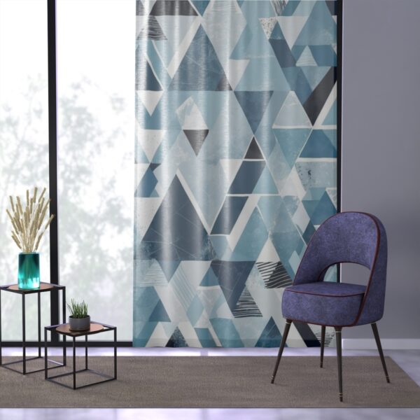 Contemporary curtain with sharp geometric shapes in arctic blue and white.