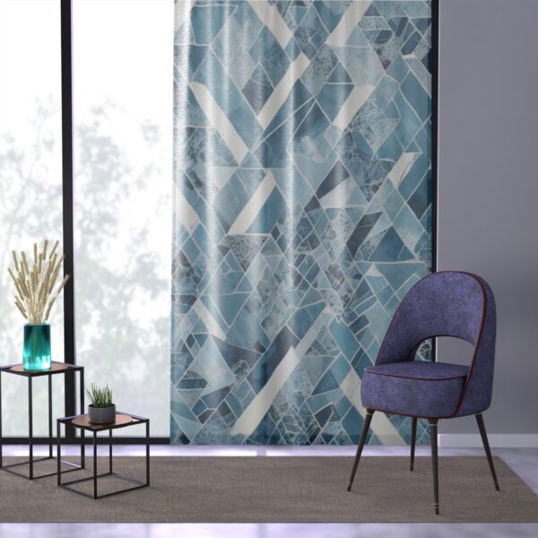 Crisp geometric design in cool arctic blues and whites on curtain.