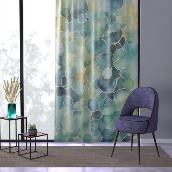 Elegant geometric shapes in lush watercolor shades on curtain.