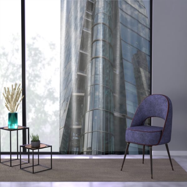 Sheer window curtain with towering urban design print