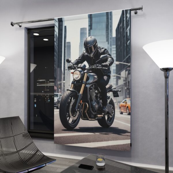 Motorcyclist riding through the city window curtain