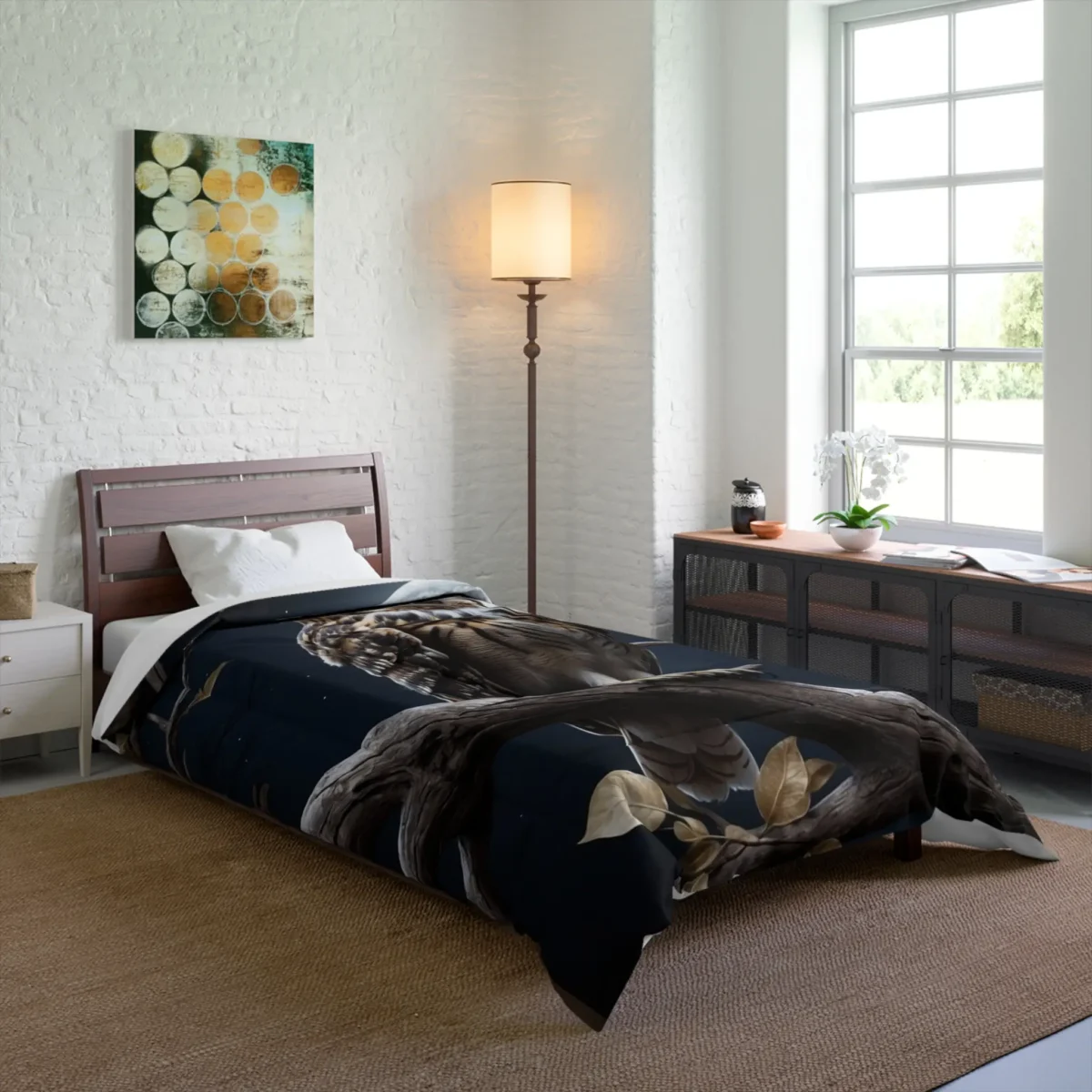 Single bed with a black comforter featuring a detailed owl illustration perched on a branch under a full moon