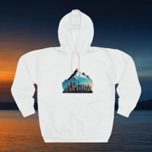 Hoodie with a minimalist design featuring a city skyline beneath snow-capped mountains and a gradient sky.