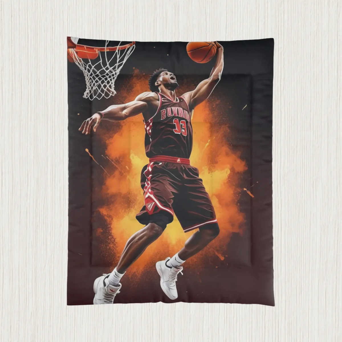 Flat view of comforter with basketball player dunking against explosive orange background