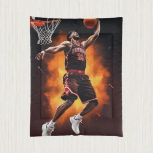 Flat view of comforter with basketball player dunking against explosive orange background