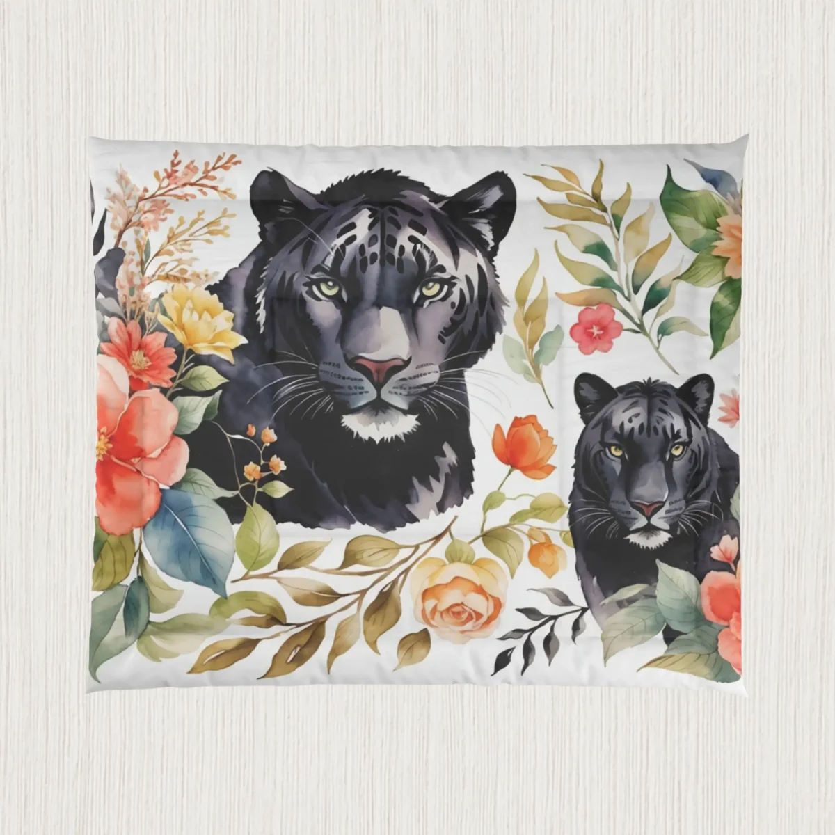 Flat view of a comforter with black panthers and colorful botanical design