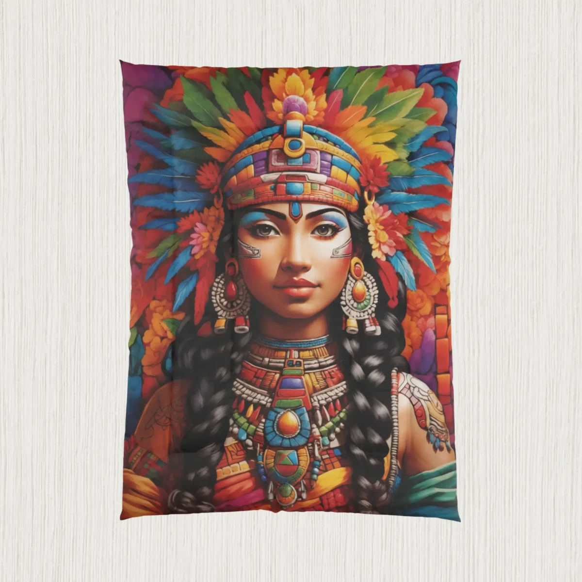 Flat-lay of comforter with Maya queen artwork and multicolored feather headdress