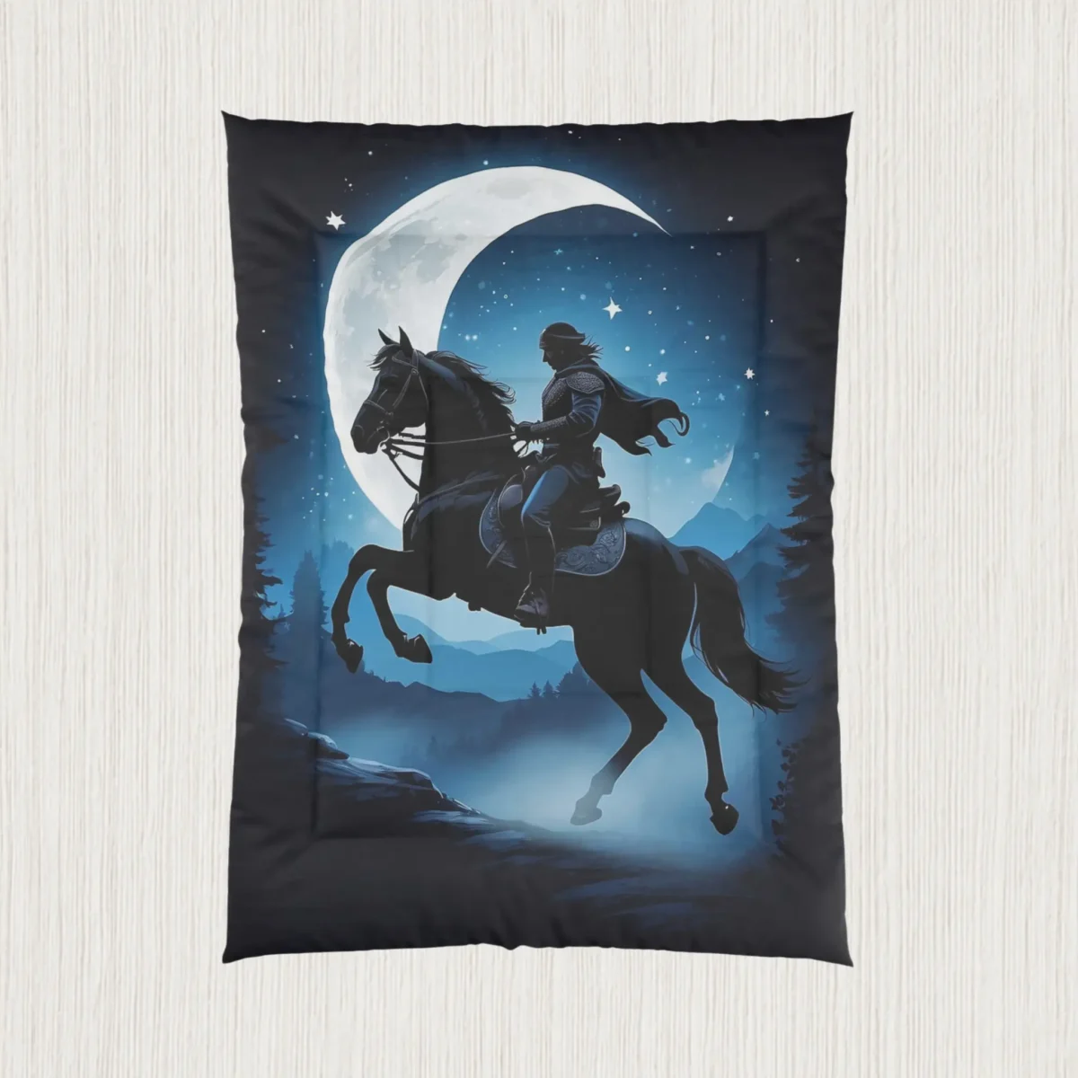 Flat-lay of comforter with fantasy illustration of a rider on a horse in a moonlit night