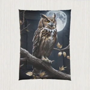 Flat-lay view of a black comforter with a realistic owl design in front of a full moon