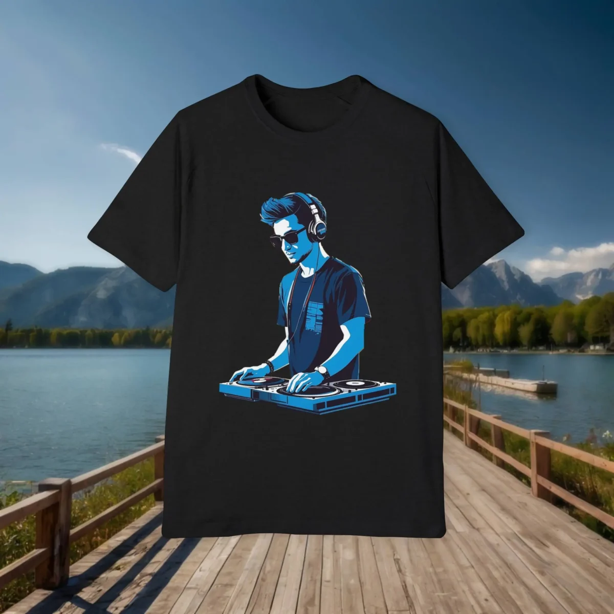Flat black t-shirt featuring a blue illustration of a DJ wearing headphones and using turntables