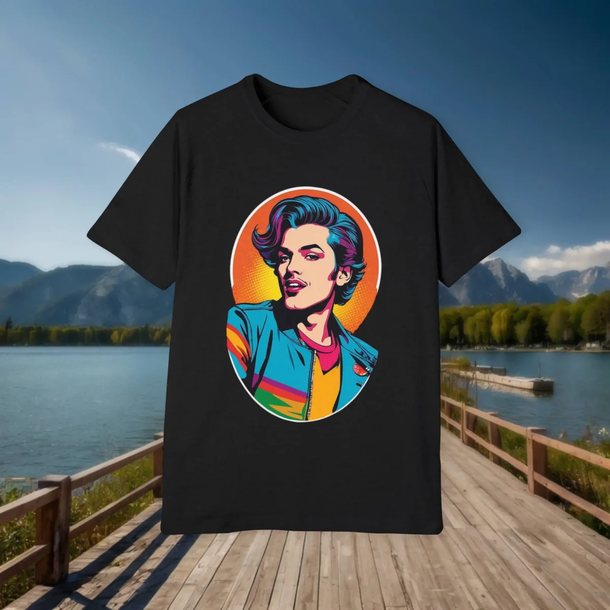 Flat black t-shirt with a vibrant pop art image of a stylish man in a colorful outfit, placed on a dock background with lake and mountains.