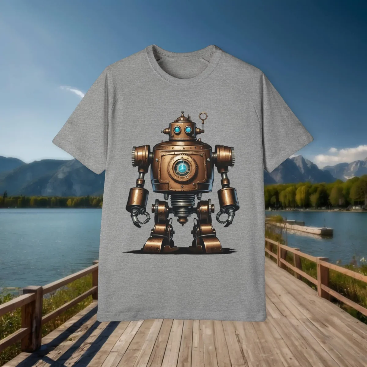 Flat grey t-shirt with a bronze steampunk-style robot illustration, set on a dock with lake and mountain background.