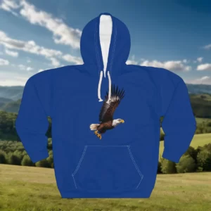 A hoodie featuring an illustration of a flying eagle with its wings spread, displayed against a mountainous and forested background.