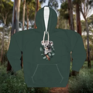 Hoodie featuring a design of a smiling koala sitting on a branch surrounded by eucalyptus leaves, set against a forest background.