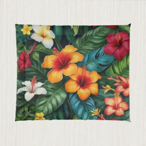 Flat view of a comforter showing colorful tropical hibiscus flowers with large jungle leaves