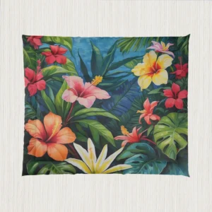 Flat view of a comforter with a dense and colorful floral pattern of hibiscus and tropical foliage