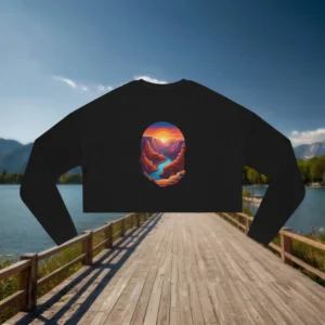 Flat lay of a black cropped sweatshirt with a colorful sunset over a canyon and river design