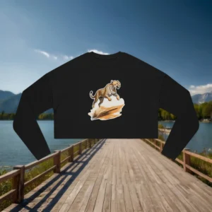 Flat lay of a black cropped sweatshirt with a graphic of a cheetah jumping in the desert