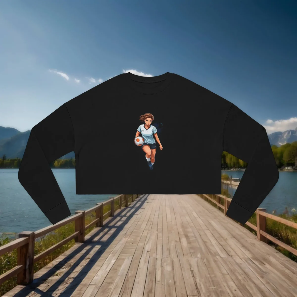 Flat lay of a black cropped sweatshirt with a female volleyball player illustration
