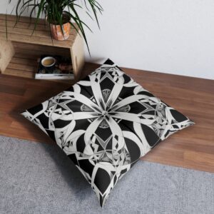 Striking cushion with intricate kaleidoscopic geometric design in bold black and white