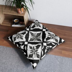 Black and white cushion with kaleidoscopic pattern of symmetrical geometric shapes