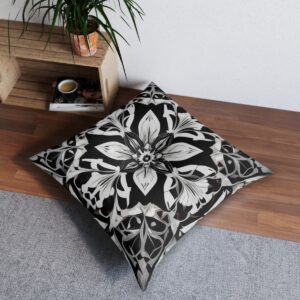 Striking pillow with black and white kaleidoscopic pattern and symmetrical geometric shapes