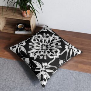 Monochrome pillow with symmetrical kaleidoscopic pattern of geometric shapes