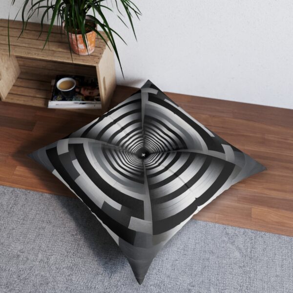 Cushion with captivating concentric rectangles in black white and gray creating tunnel-like effect