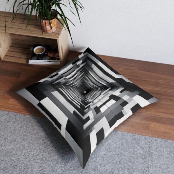 Hypnotic tunnel effect cushion with concentric rectangles in black white and gray