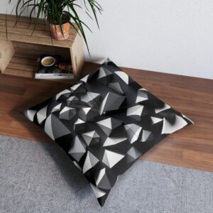 Sophisticated tufted floor pillow with striking white polygons on deep black canvas