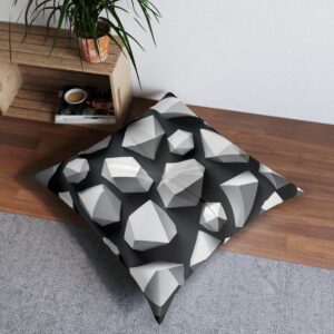 Stylish white polygonal design tufted floor pillow with grey shadows on black backdrop