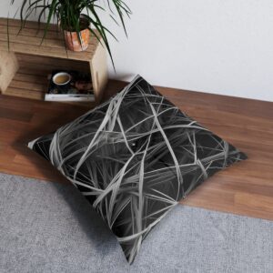 Bold monochrome lines intersecting tufted floor pillow