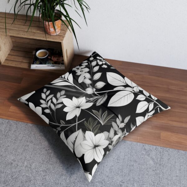 Modern abstract monochrome foliage tufted floor pillow in elegant setting