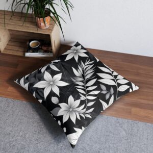 Striking abstract monochrome foliage tufted floor pillow on floor