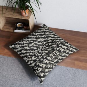 Contemporary houndstooth tufted floor pillow on wooden floor