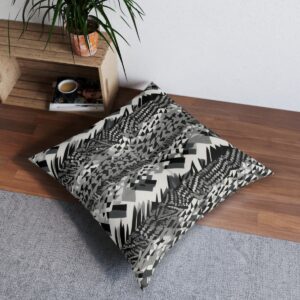 Vibrant black and white geometric tufted floor pillow in a modern home