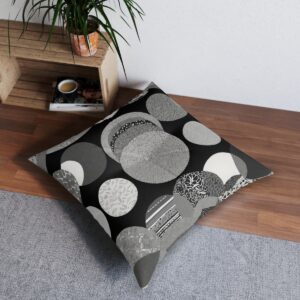 Tufted floor pillow with monochrome patterns in perfect circles