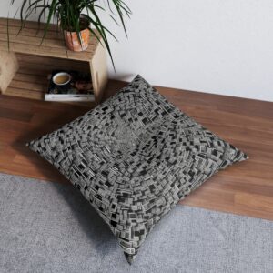 Intricate pattern of rotated black squares creating a spiraling effect on a tufted floor pillow