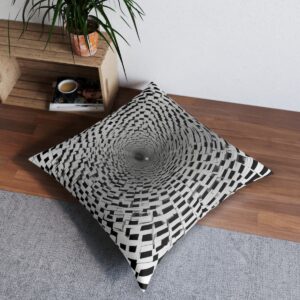 Black squares rotating around a central point creating a spiral on a white tufted floor pillow