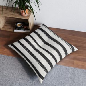 Black and white vertical line tufted floor pillow with a subtle grid pattern