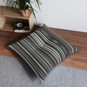 Minimalist black and white striped tufted floor pillow with elegant wave effect